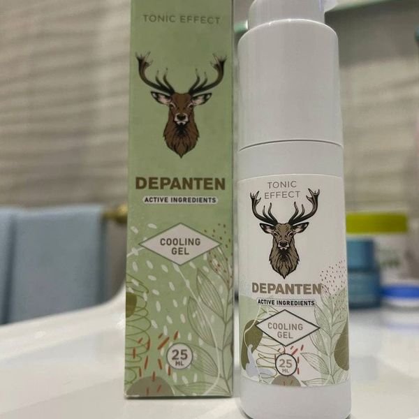 Flacone airless bianco di Depanten con la scatola verde e il cervo